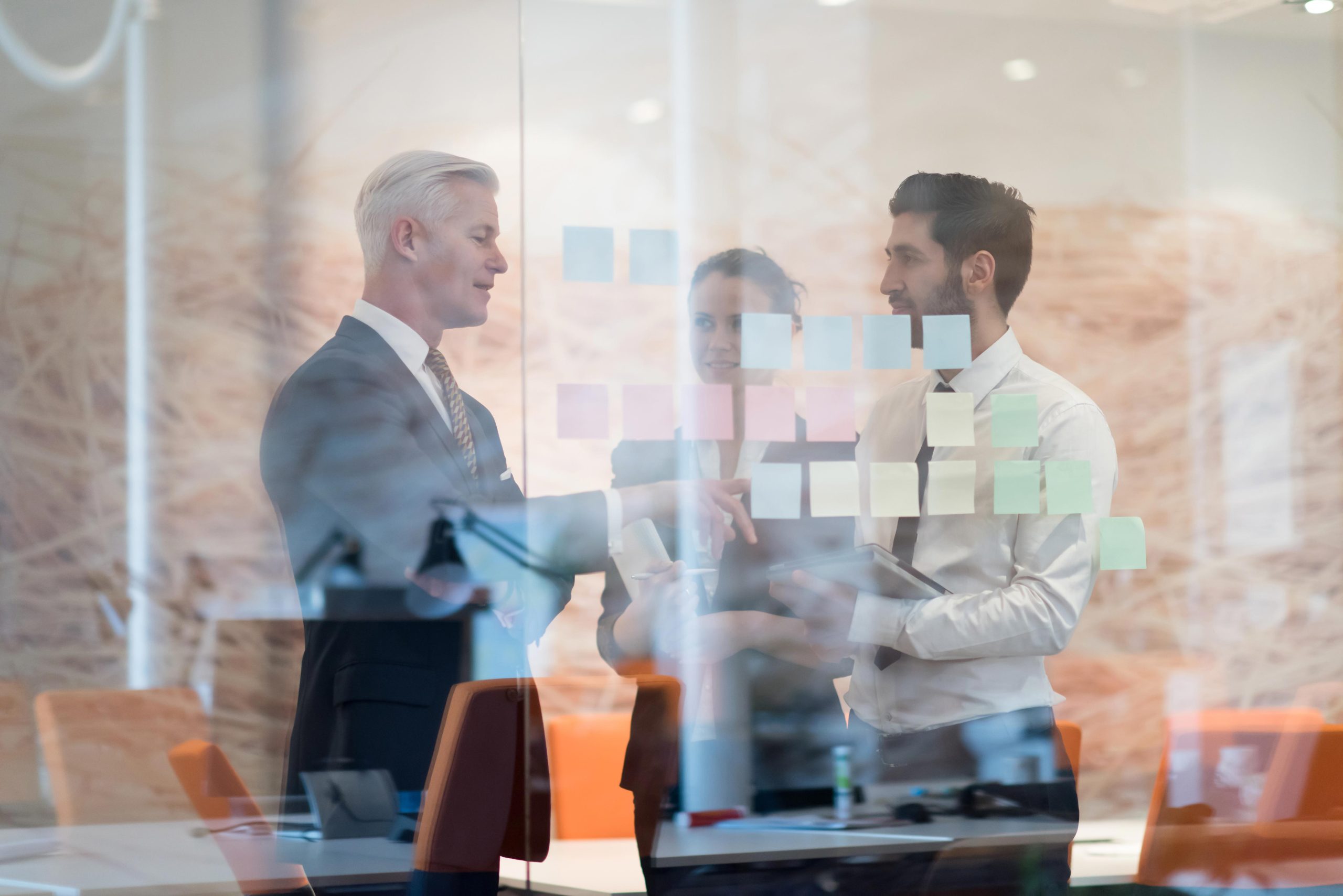 2-men-and-a-woman-talking-through-window